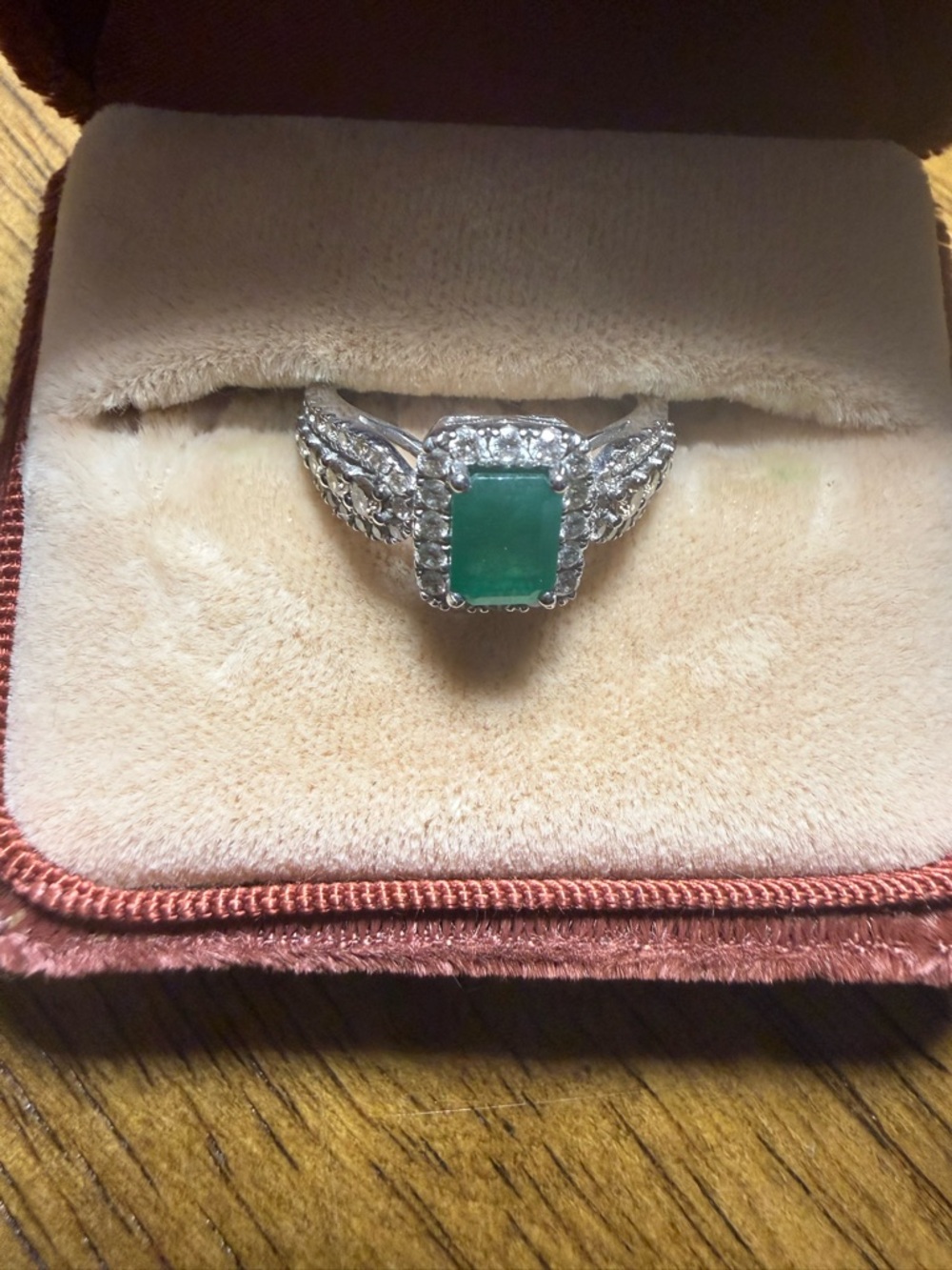 Le Vian emerald ring with white diamond halo and chocolate diamonds on the side